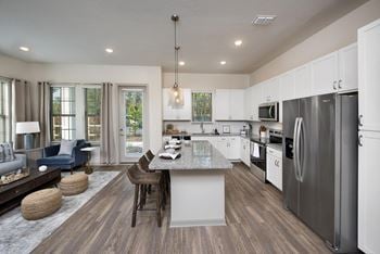 Luxury wood style flooring throughout living and kitchen areas